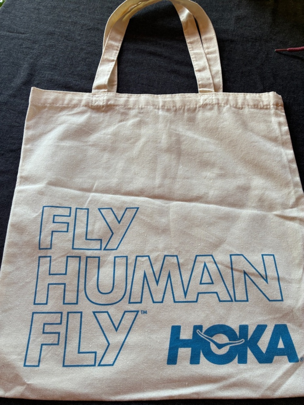 Hoka Natural Canvas Tote with Blue 'FLY HUMAN FLY' Print
